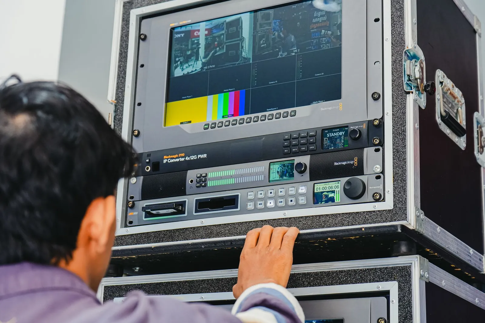A technician manages professional broadcasting equipment in a control room setting. Stock photo illustrating Zee Entertainment Enterprises' product launched story.