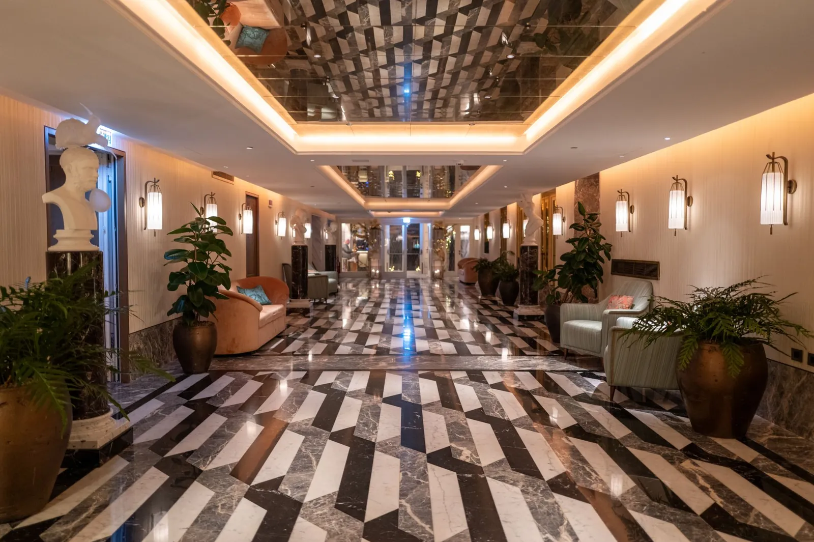 Elegant hotel lobby featuring luxurious marble flooring and stylish furnishings. Stock photo illustrating Samhi Hotels' earning call story.