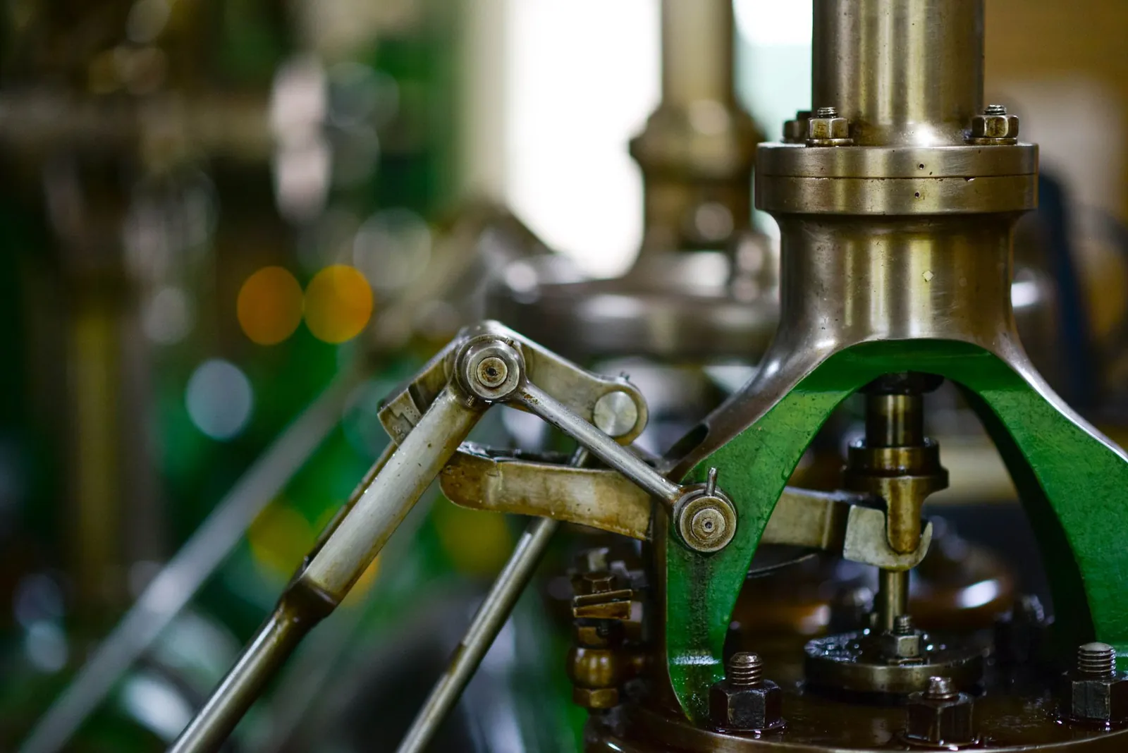 Detailed view of mechanical components in an industrial setting, showcasing metal gears and levers. Stock photo illustrating Simplex Castings' earning call story.