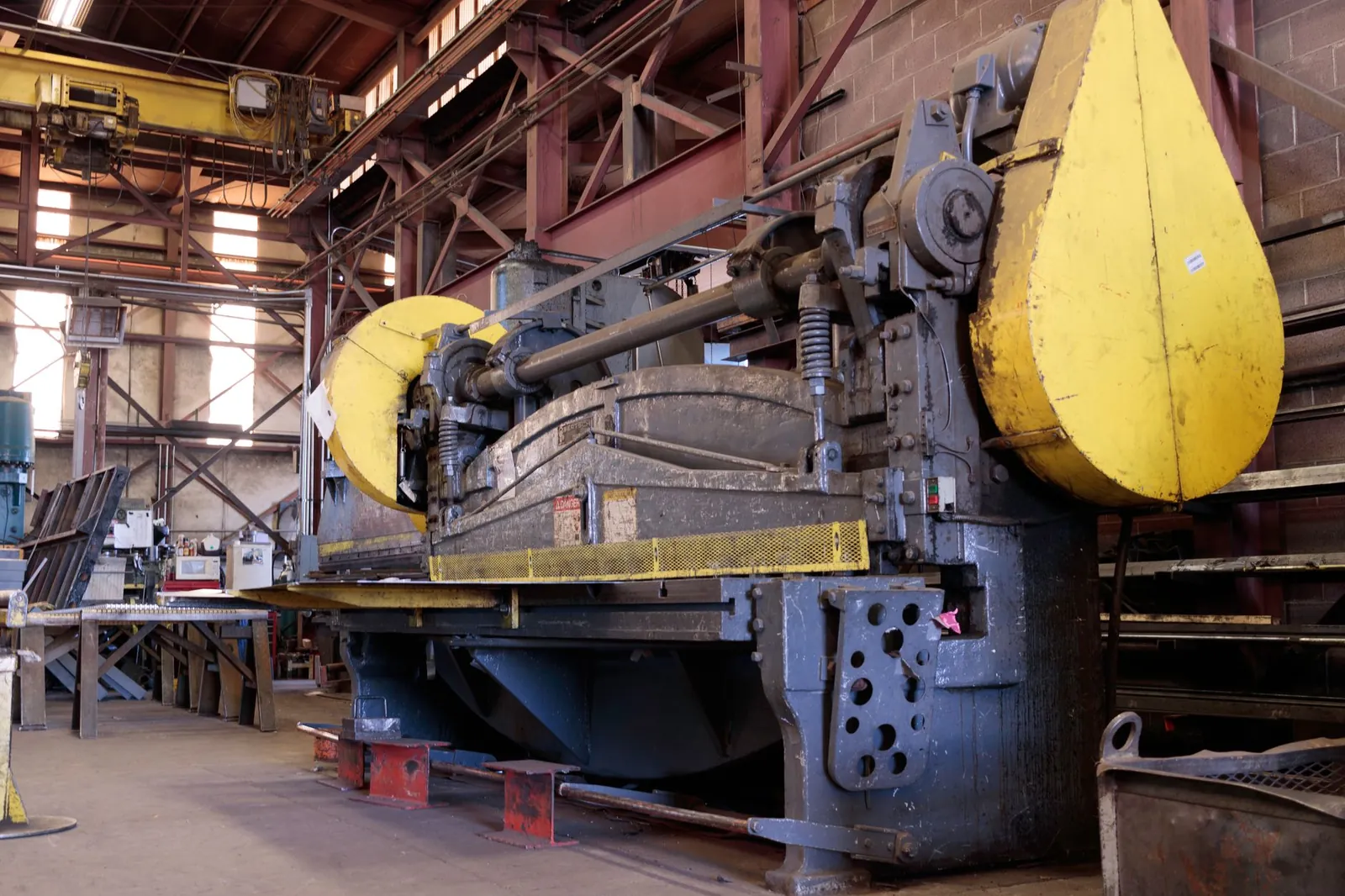 Heavy-duty industrial machine in a factory's production line, showcasing machinery details. Stock photo illustrating John Cockerill India's new order story.