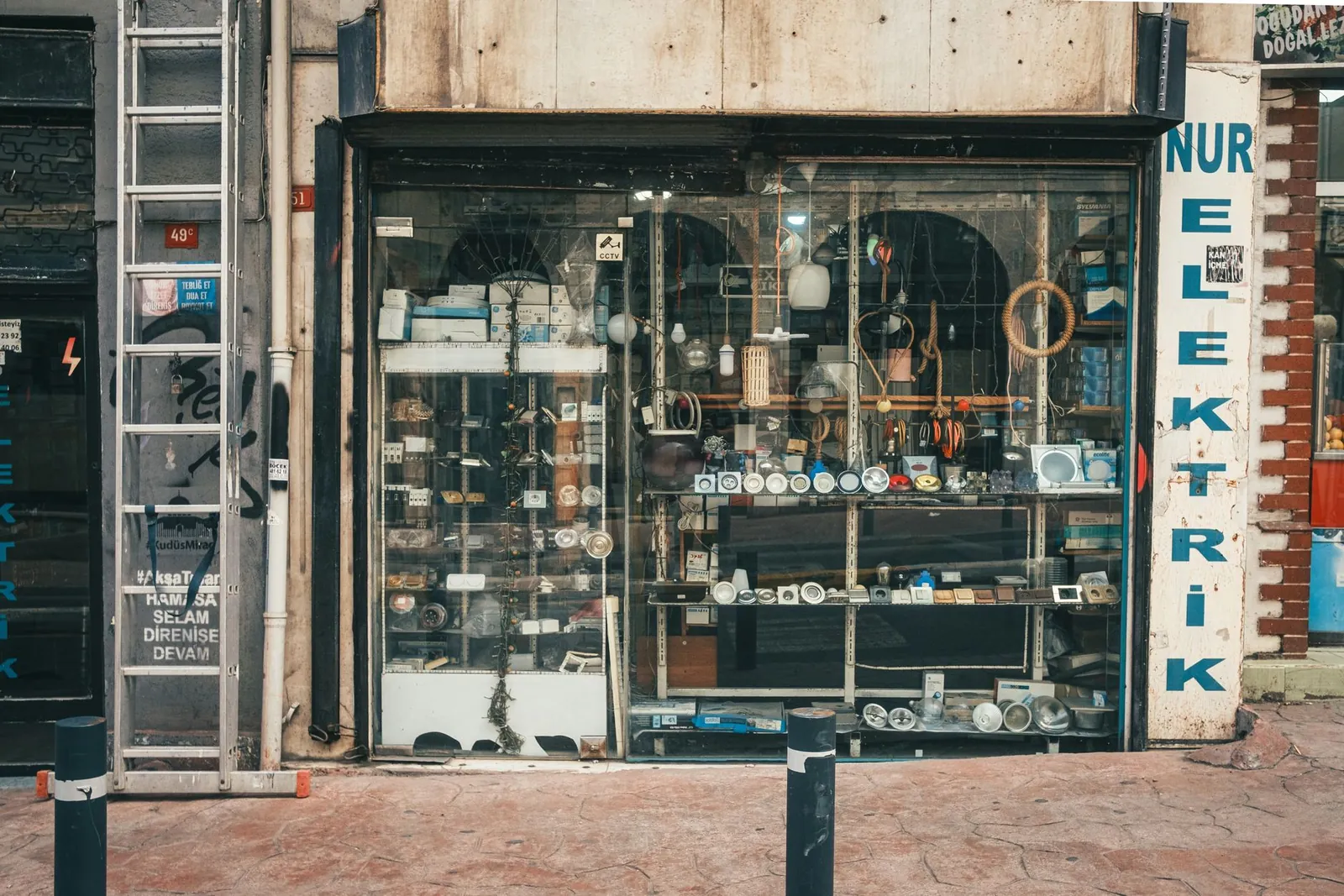 Showcase of a vintage electrical store with assorted gadgets in a rustic setting. Stock photo illustrating Aditya Vision's earning call story.