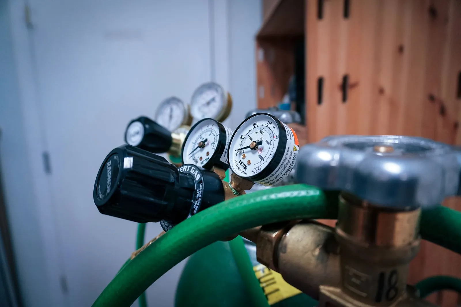Detailed view of gas pressure gauges on equipment in an industrial setting. Stock photo illustrating Everest Kanto Cylinder's production started story.