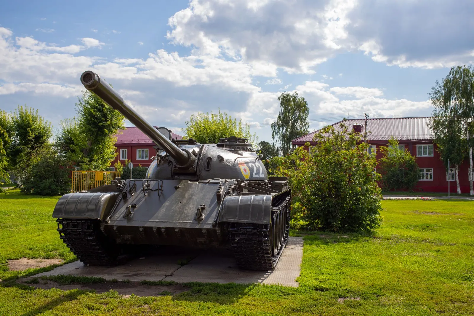 Classic military tank on display in a sunny park setting, showcasing history. Stock photo illustrating Zen Technologies' new order story.