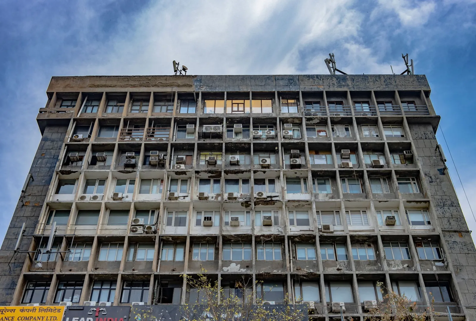 Detailed facade of a modernist building with air conditioners in New Delhi. Stock photo illustrating Union Bank of India's fund raise story.