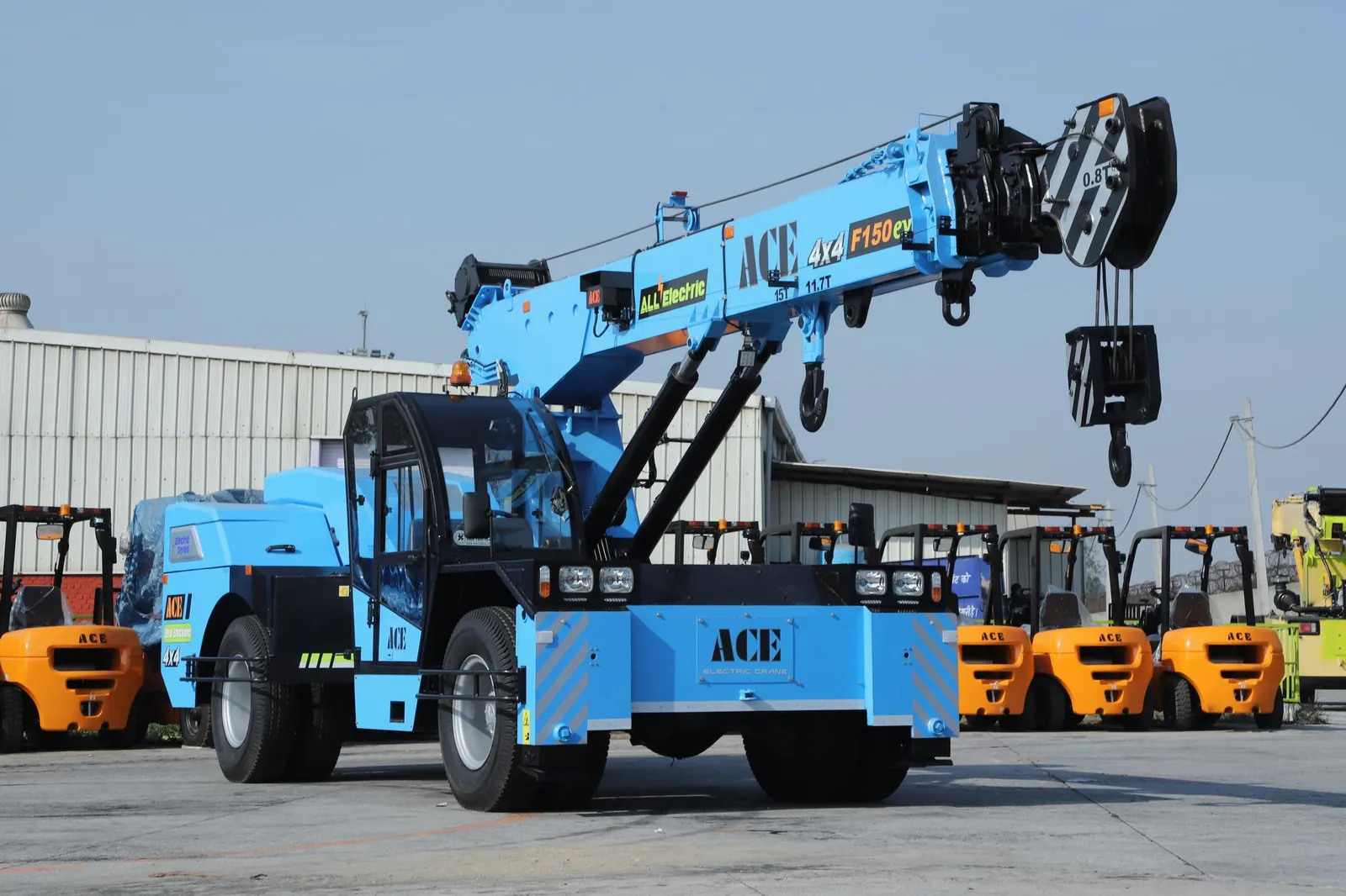 A powerful ACE F150EV electric crane showcased in an industrial outdoor location in India. Stock photo illustrating Trishakti Industries' earning call story.