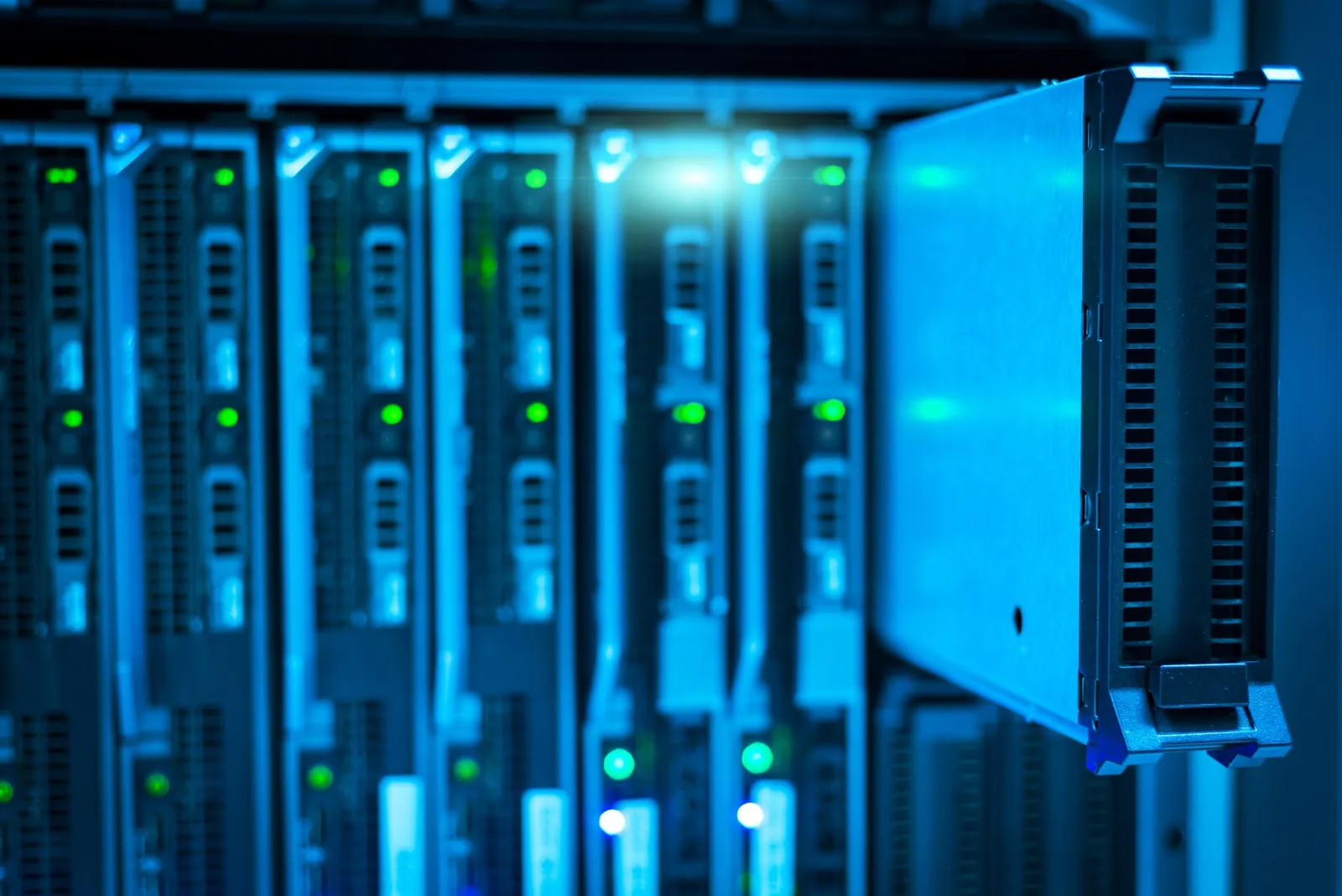 Detailed view of a server rack with a focus on technology and data storage. Stock photo illustrating Dynacons Systems & Solutions' new order story.
