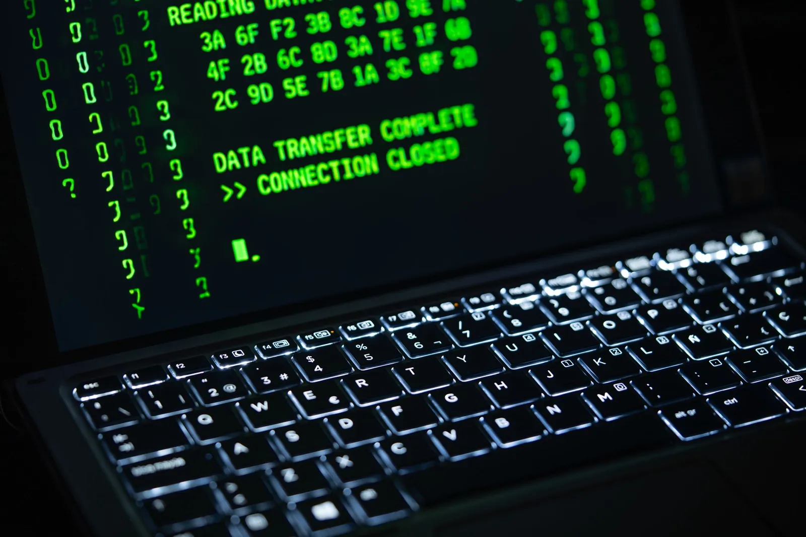 Close-up of a laptop screen displaying green code text. Perfect for cybersecurity themes. Stock photo illustrating Bharti Airtel's product launched story.
