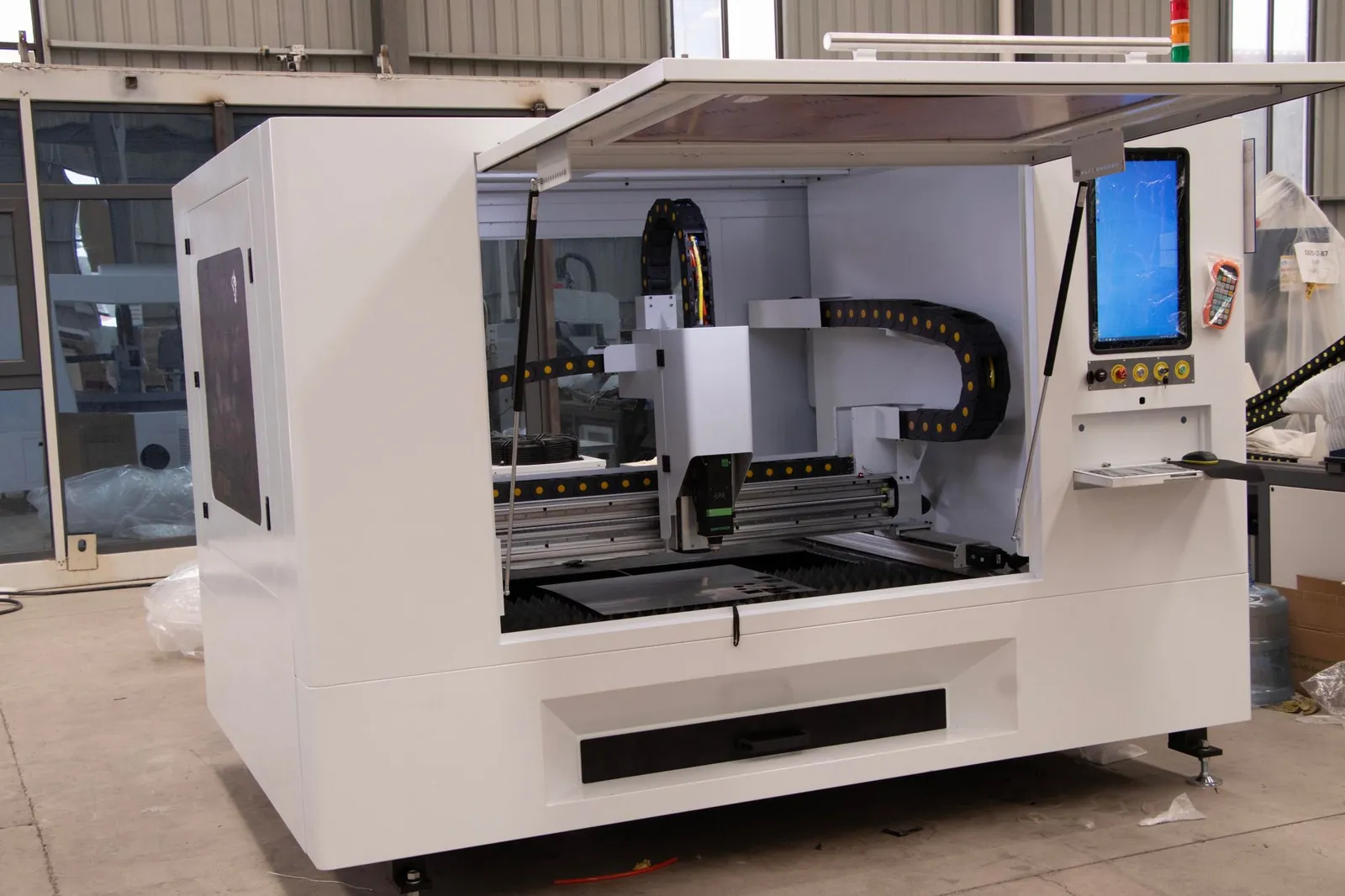 Advanced CNC machine in a manufacturing facility showcasing modern industrial technology. Stock photo illustrating Premier Energies' expansion story.