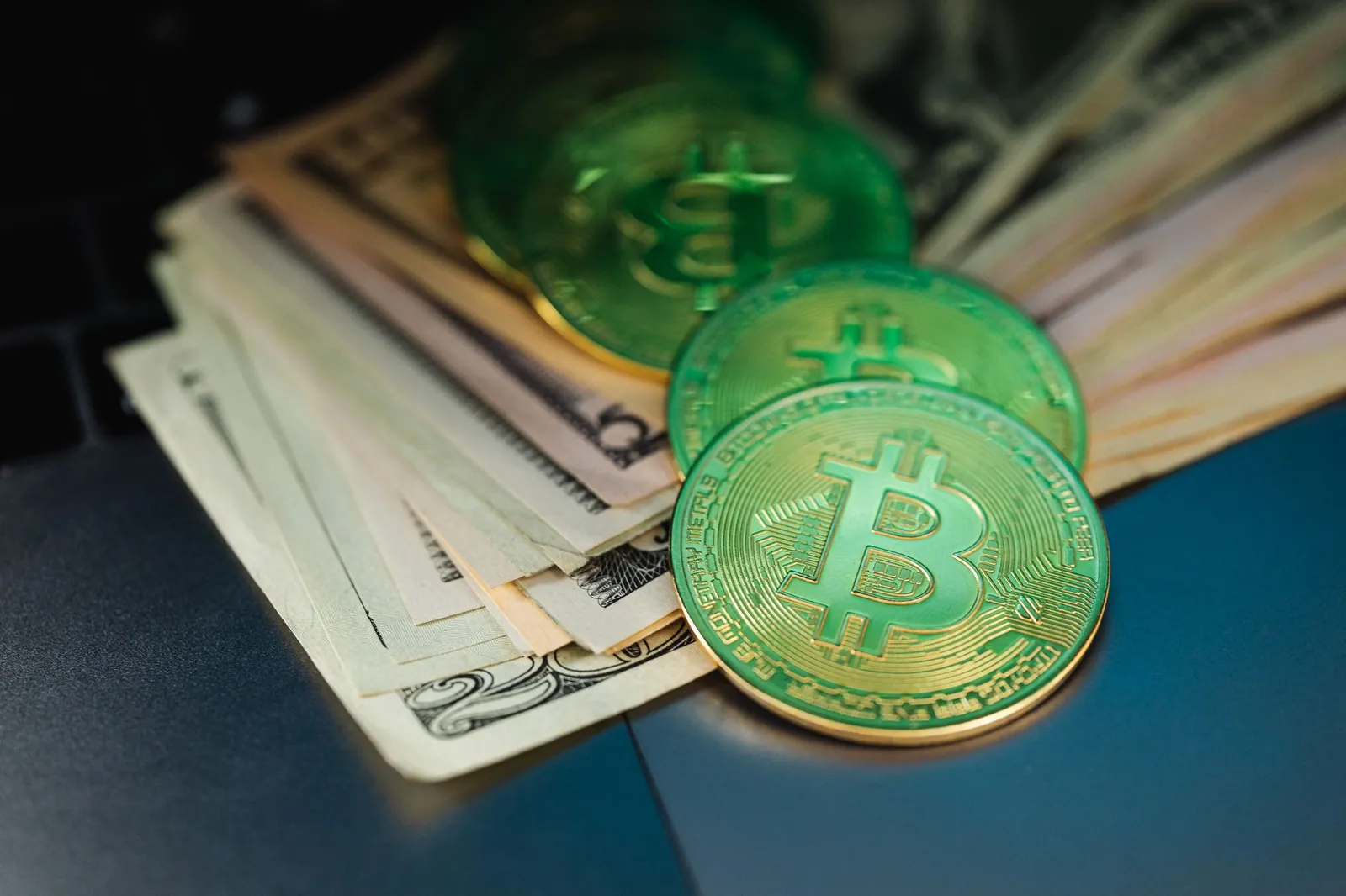Close-up of Bitcoin with US dollars symbolizing digital and paper currency. Stock photo illustrating State Bank of India's fund raise story.