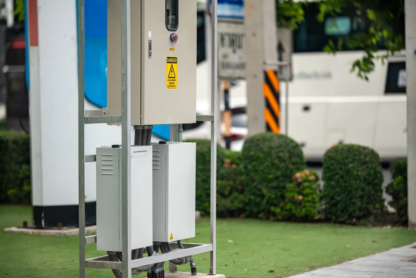 Modern electric vehicle charging station with greenery in an urban setting. Stock photo illustrating Hero MotoCorp's product launched story.