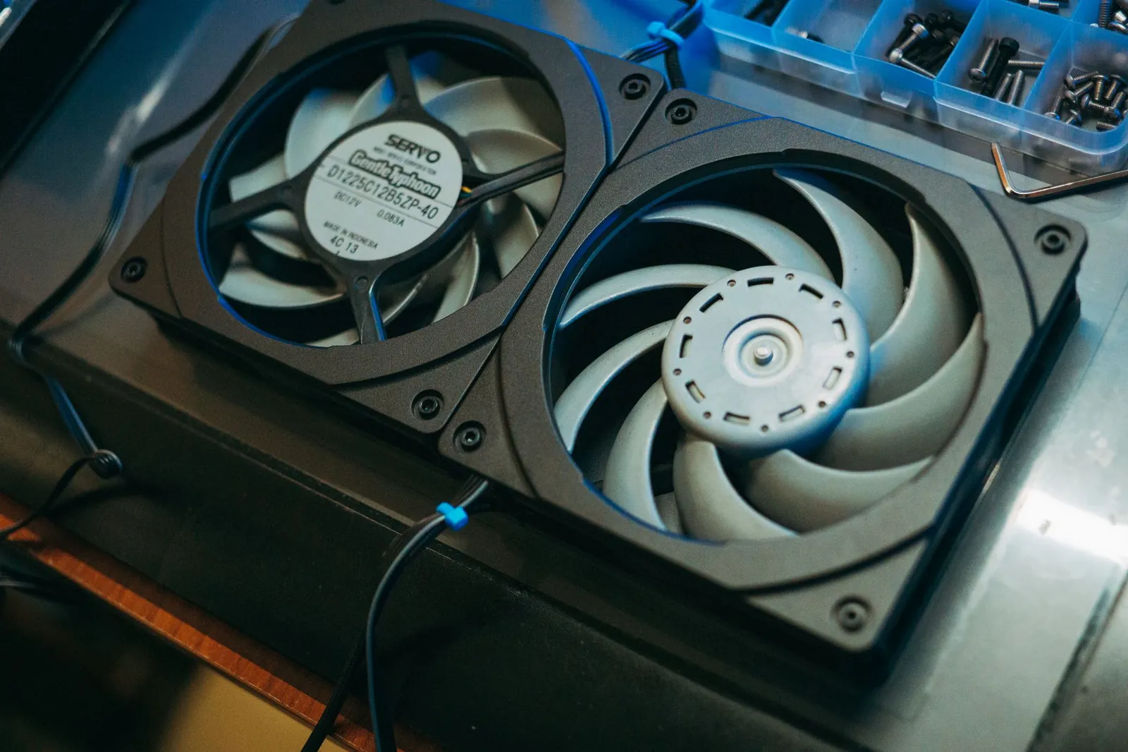 Pair of computer cooling fans on a metal surface for heat dissipation. Stock photo illustrating Patels Airtemp India's new order story.