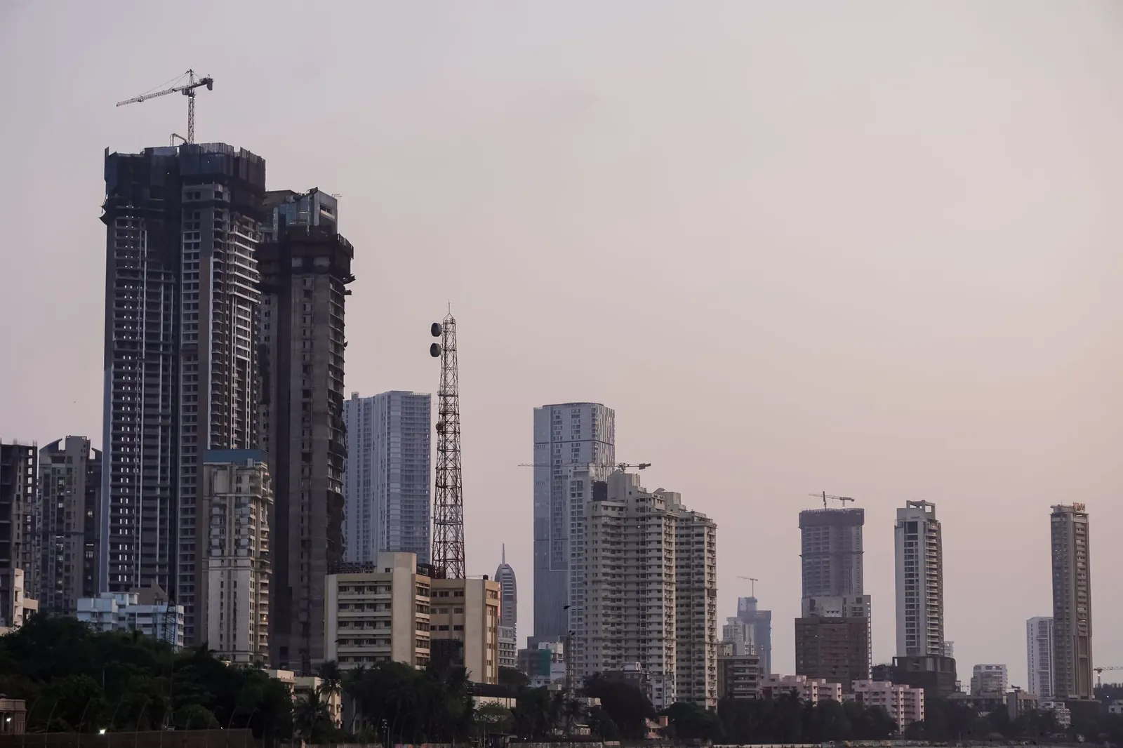 Twilight view of Mumbai's skyline showcasing tall buildings and a serene evening ambiance. Stock photo illustrating BSE's regulatory approval story.